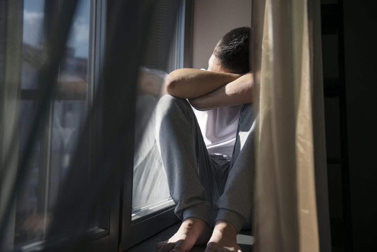 creative-portrait-man-with-curtains-shadows-from-window-1200x801.jpg